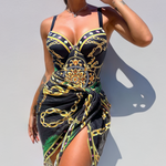 Aitana - maillot une pièce noir à motifs dorés et verts avec paréo noué, vue de face